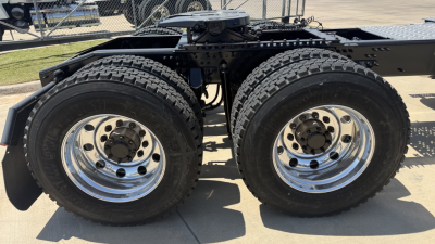 Dual rear wheels on a 2026 Mack PI64T truck chassis showing heavy-duty tires and chrome rims.