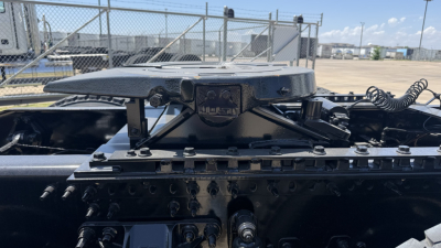 Mack PI64T truck cab chassis showing top of engine area and mounting components.