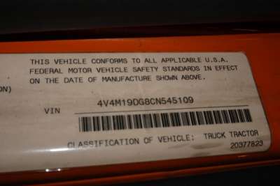 Label on a Volvo truck shows VIN 4V4M19DG8CN545109 and barcode with text 'THIS VEHICLE CONFORMS...'