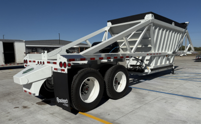 Trailer showing white Armor Lite SBD40 dump trailer with tri-axle configuration and skeletal frame, rear view highlighting dump bed and wheels.