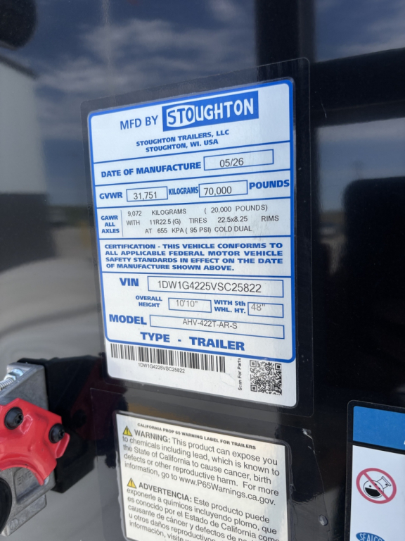 Stoughton aluminum grain hopper trailer sticker showing MFD BY STOUGHTON label, date of manufacture 05/26, GVWR 31,751 kg? 70,000 lbs, VIN 1DW1G4225VSC25822, model AHY-? 422R-? Type: Trailer.