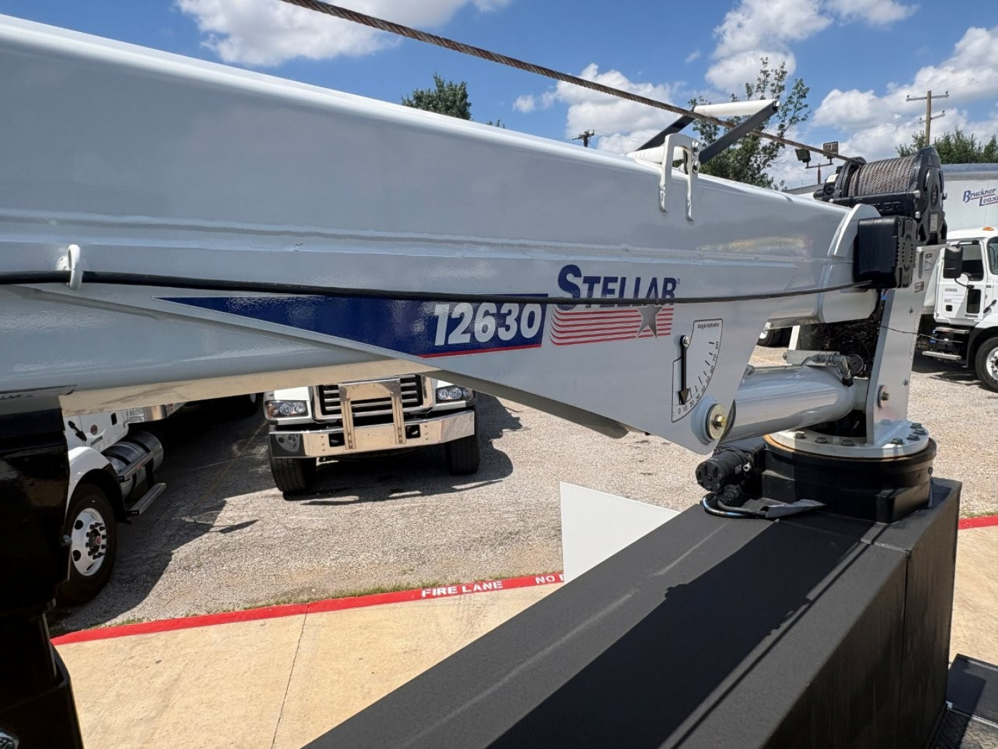 Mack MD6 crane arm showing Stellar 12630 label and American flag decal