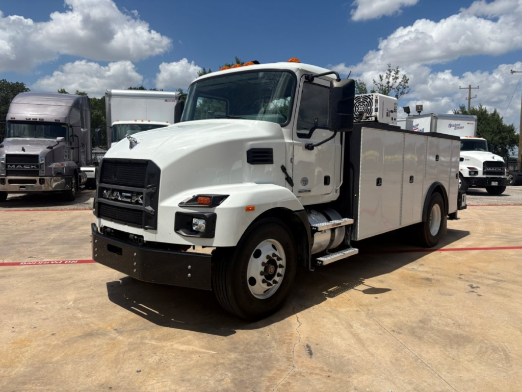 Service/utility truck showing Mack MD6 front-left view with utility body and compartments