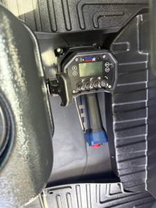 Panel with a Speed Star controller mounted inside a Mack MD6 cab area showing digital display and wiring connectors.