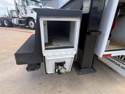 Mack MD6 component showing front storage compartment and draw latch, metal frame, and white inner opening.