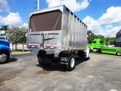 Truck rear view of a 2014 Freightliner M2 106 dump bed with mesh rear gate and black rear bumper, visible stock number 183002R.
