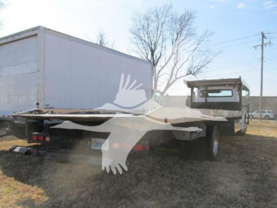 Freightliner M2 106 auto carrier truck rear and side view showing flatbed and cab with box trailer attached