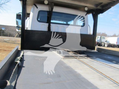 Truck bed of 2019 Freightliner M2 106 with flatbed equipment and rear cab view