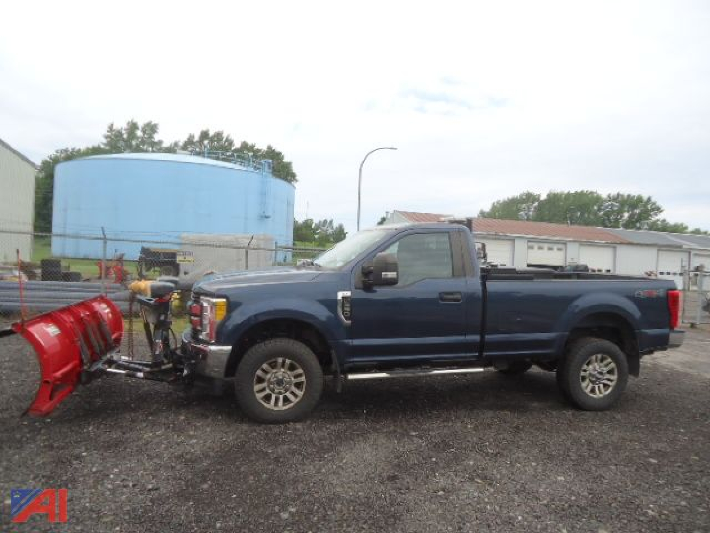 2017 Ford F-350XLT Super Duty pickup with plow attached, side view in a gravel lot.