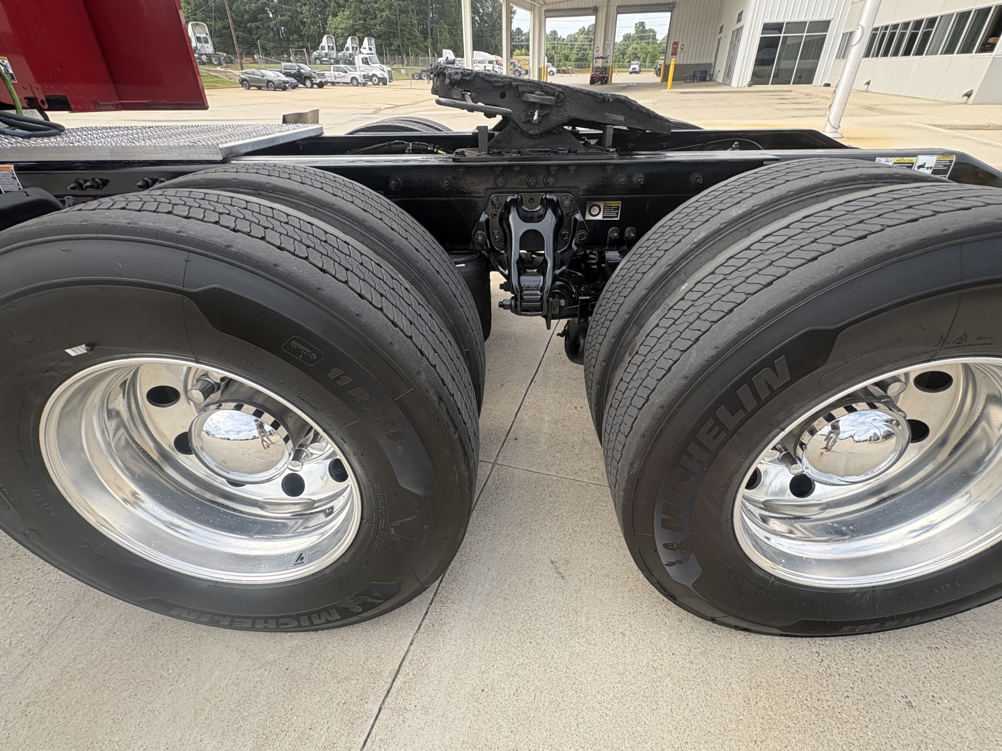 Peterbilt 579 tractor rear dual wheels showing tires and fifth wheel hitch connection