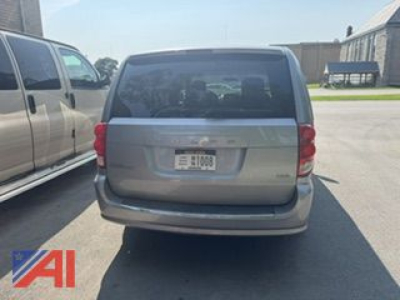 Rear view of a 2016 Dodge Grand Caravan showing tailgate and license plate area.