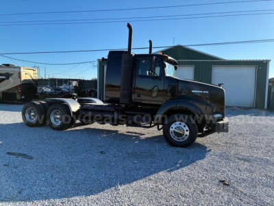 2008 Western Star 4900 SA truck in a lot, black cab, tandem axle chassis, chrome wheels, dual exhaust stacks visible.