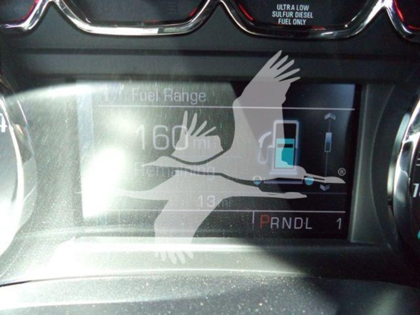 Truck dashboard showing fuel range gauge and gear indicator (PRNDL) in Chevrolet Silverado 6500HD interior.