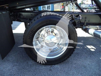 Chevrolet Silverado 6500HD truck wheel and suspension components showing chrome hub and tire sidewall