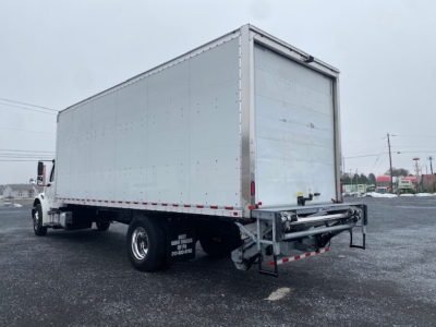 Freightliner M2-106 box truck rear and side view showing cargo box with aluminum panels and rear underride guard.