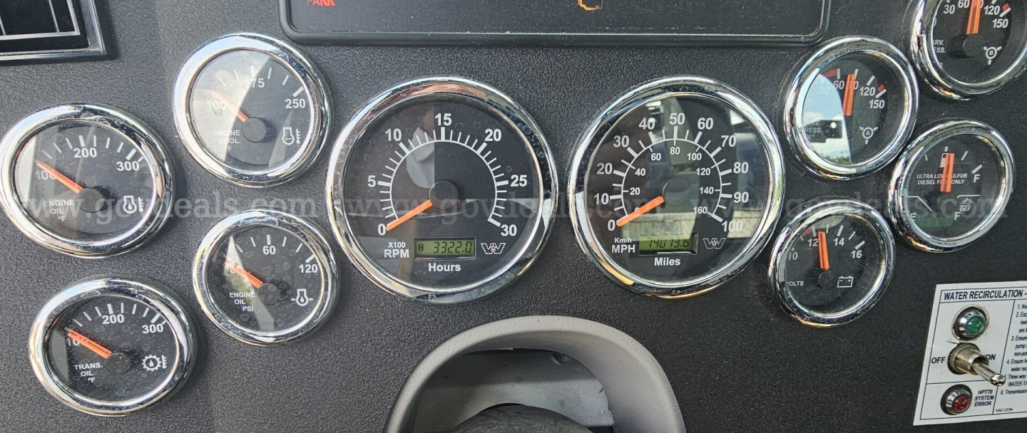 Dashboard cluster of a Western Star truck showing multiple gauges including RPM, speed, and engine indicators.