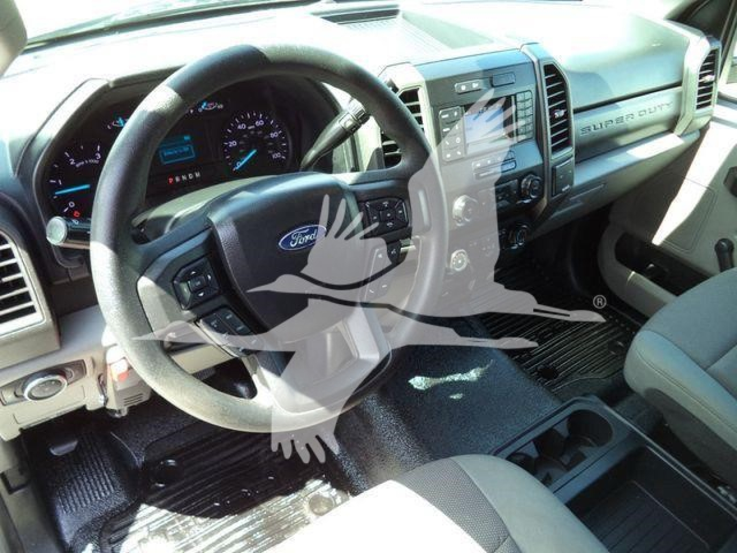 Ford F-550 interior with steering wheel and dashboard view.