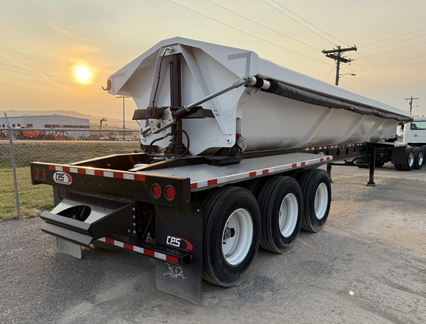 Manac 42' tri-axle dump trailer showing side view and rear with CPS wheels and hydraulics labels.
