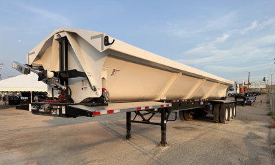 Manac 42' tri-axle dump trailer in light beige showing side view and front landing gear.