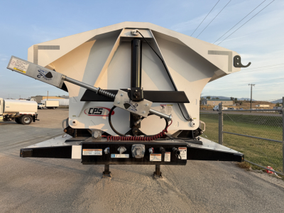 Manac 42' tri-axle dump trailer rear view showing hydraulic power unit and control lever with CPS label.