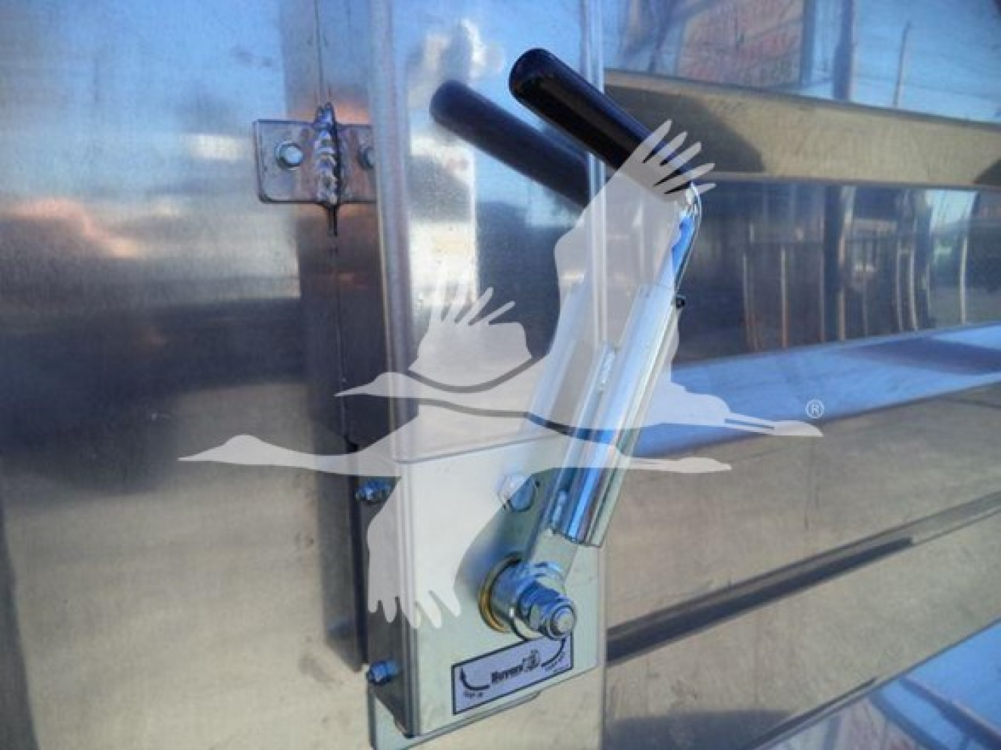 Isuzu NPRHD truck door with chrome latching mechanism and handle showing a key lock and hydraulic latch.