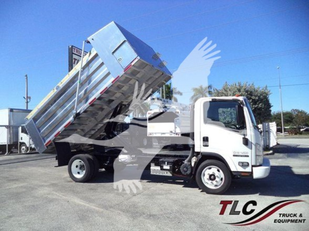 Isuzu NPR HD dump truck in service position with hauling bed raised, front cab and wheels visible, dealership lot background.