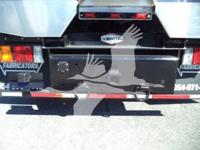 Rear view of a 2020 Isuzu NPR-HD truck showing bumper with metal hitch, labels, and vendor logos; visible text includes 'FABRICATORS' on both sides and a central rear plate area.