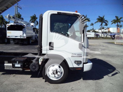 Isuzu NPR HD truck cab in profile showing GDW 14500 label and side mirror, with chassis and equipment hitch visible.