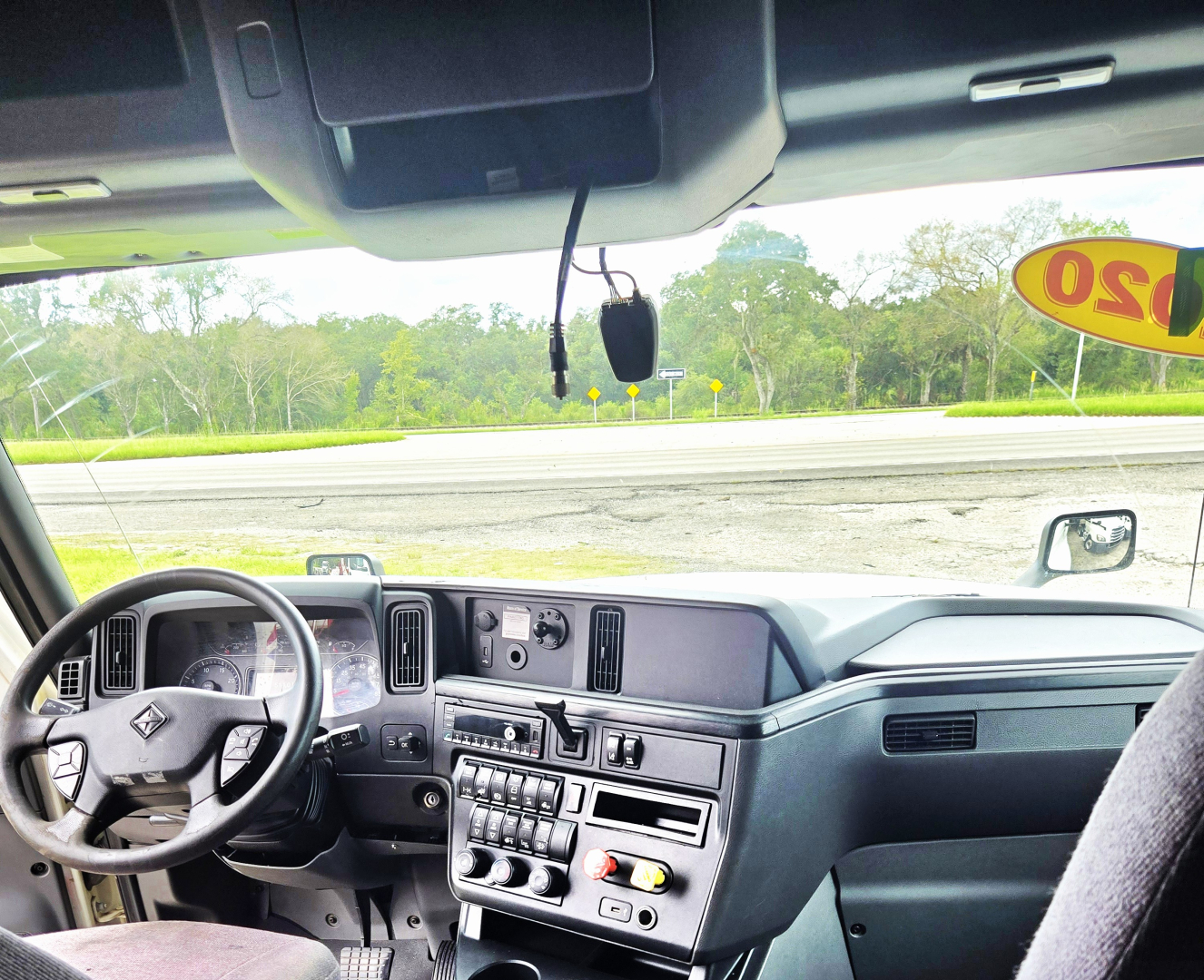 Dashboard and steering wheel of a 2020 International CONDO double bunk sleeper cab showing the instrument cluster, center control panel, and windshield; no visible labels or serials readable.