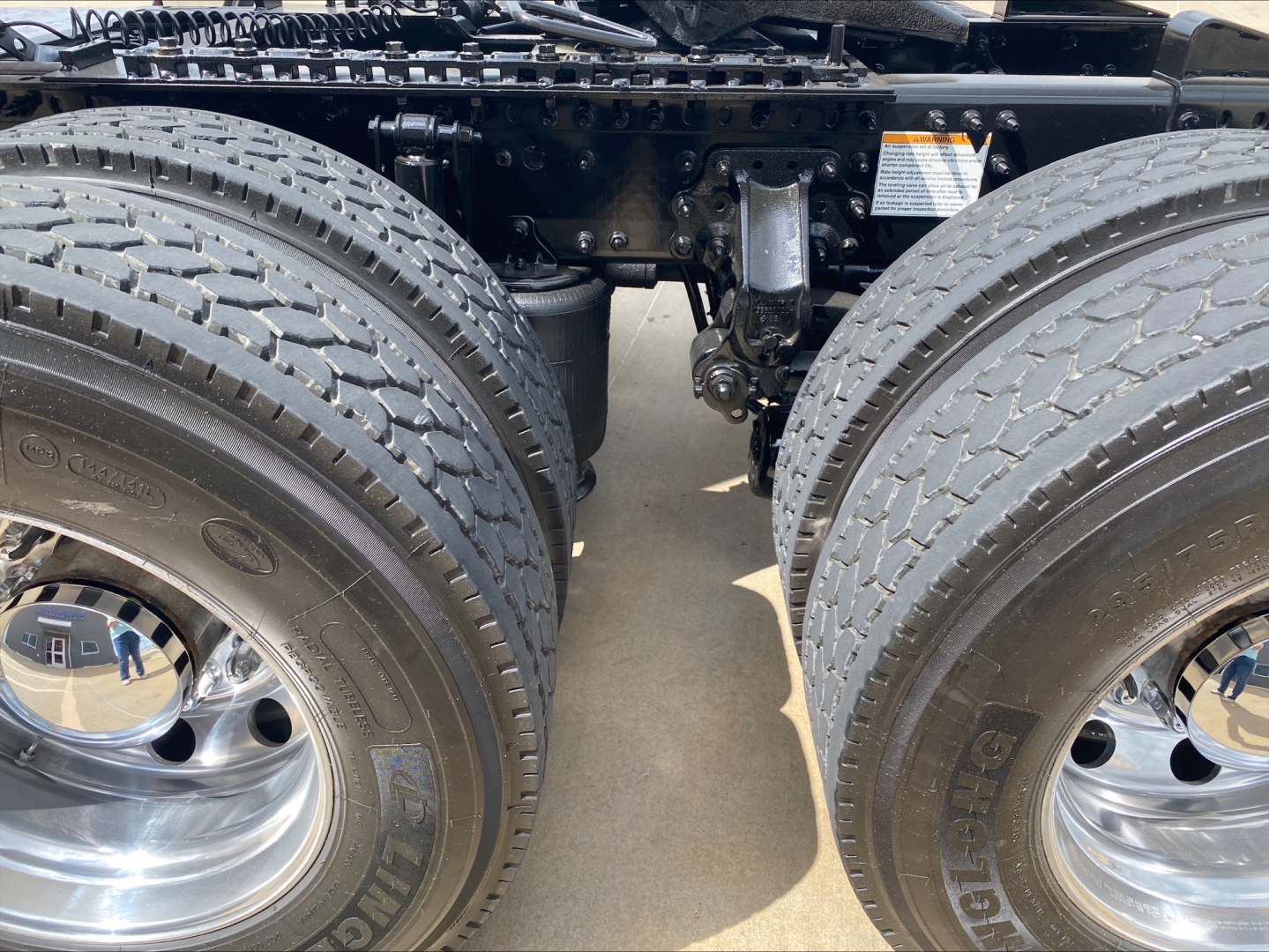 Mack AN64T70 truck rear chassis with dual rear axles and large tires showing frame rails and suspension components.