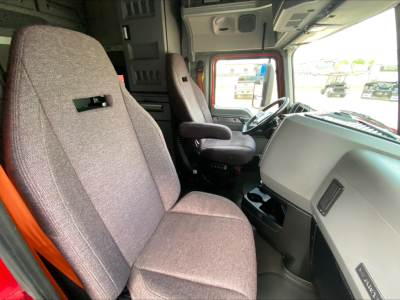 Cab interior of a 2020 Mack AN64T70 truck showing driver seat, passenger seat, and dashboard area.