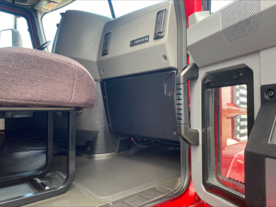 Cab interior of a 2020 Mack AN64T70 truck showing the driver cabin area with the dash, glove box, and door frame.