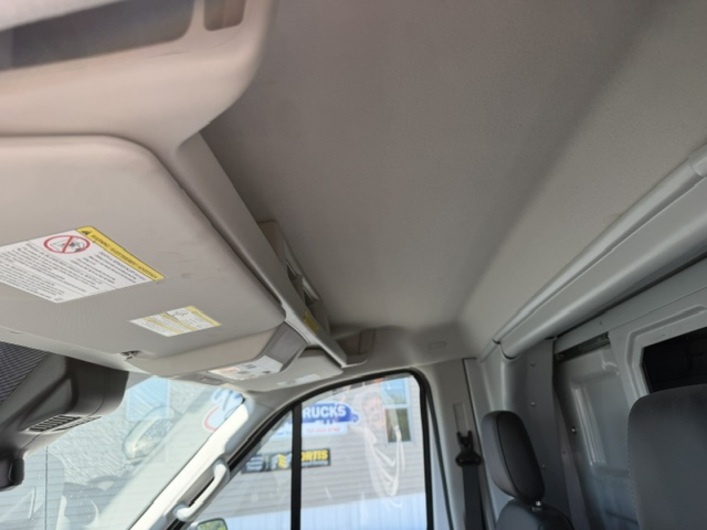 Ford Transit 350HD service/utility van interior roof and sun visor area visible.