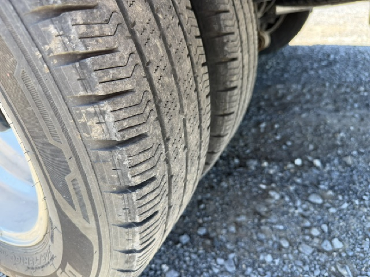 Ford Transit 350HD wheel/tire tread close-up with dual rear wheels visible.