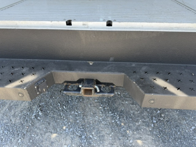 Ford Transit 350HD rear hitch and bumper view showing trailer hitch and step plates.