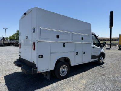 Ford Transit 350HD service utility van rear and side view showing utility compartments and cargo boxes.