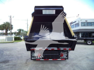 Back view of a 2018 Ford F550 XL dump truck in service showing dump bed and rear tailgate with lights and reflective strips.