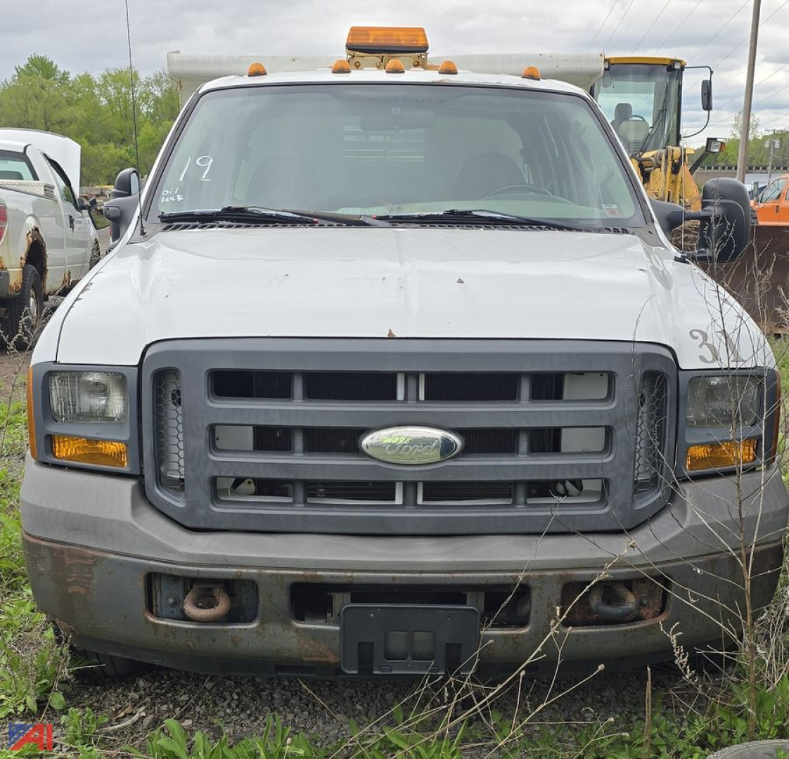 Front view of a white 2005 Ford F-350 XL Super Duty dump truck showing grille and bumper details.