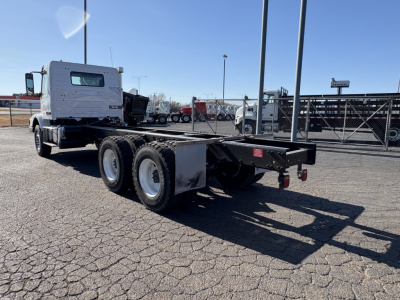 Volvo VHD64B300 chassis rear view showing dual rear axles and flatbed frame.