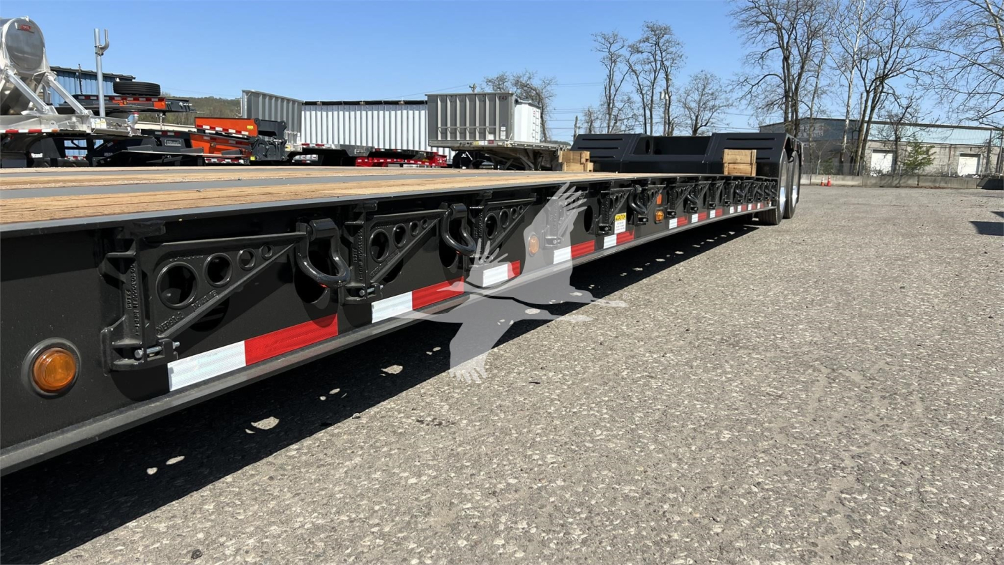 Fontaine XN20 lowboy trailer side view showing steel frame with deck, pivot points, and marker lights