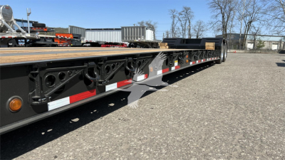  Fontaine XN20 lowboy trailer side view showing steel frame with deck, pivot points, and marker lights