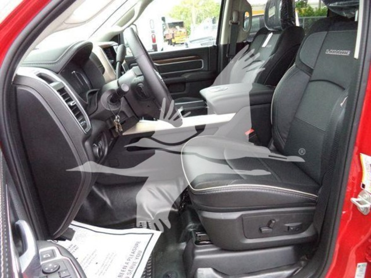Ram 1500 interior showing front seats and center console.