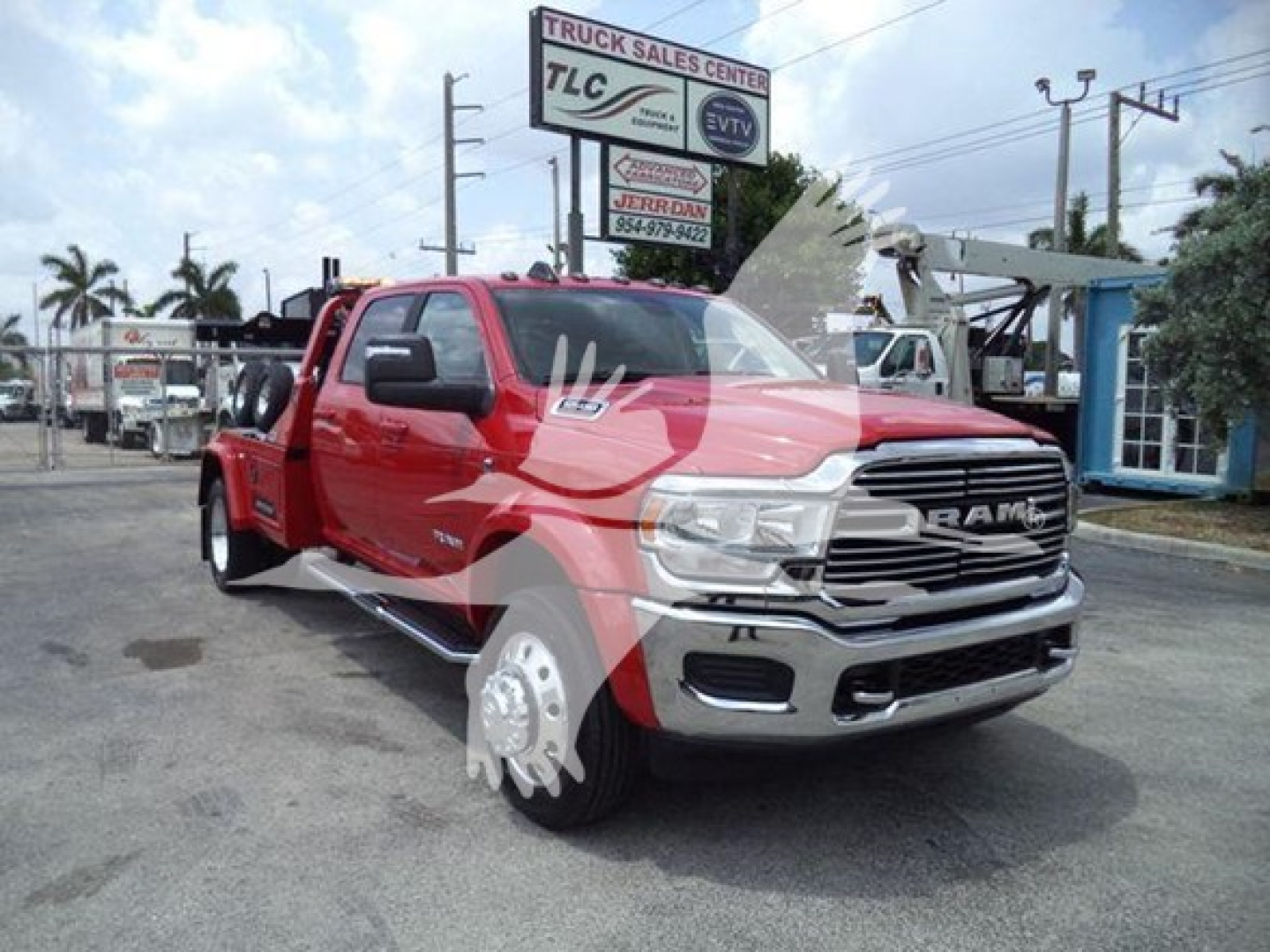 Ram truck in red with chrome grille and large D-shaped headlights, front three-quarter view, winch category vehicle.