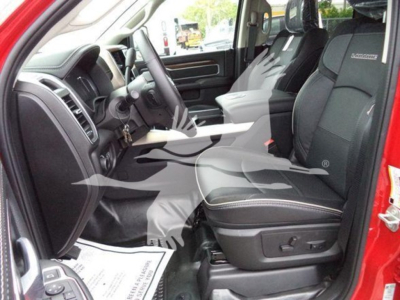 Ram 1500 interior showing front seats and center console.