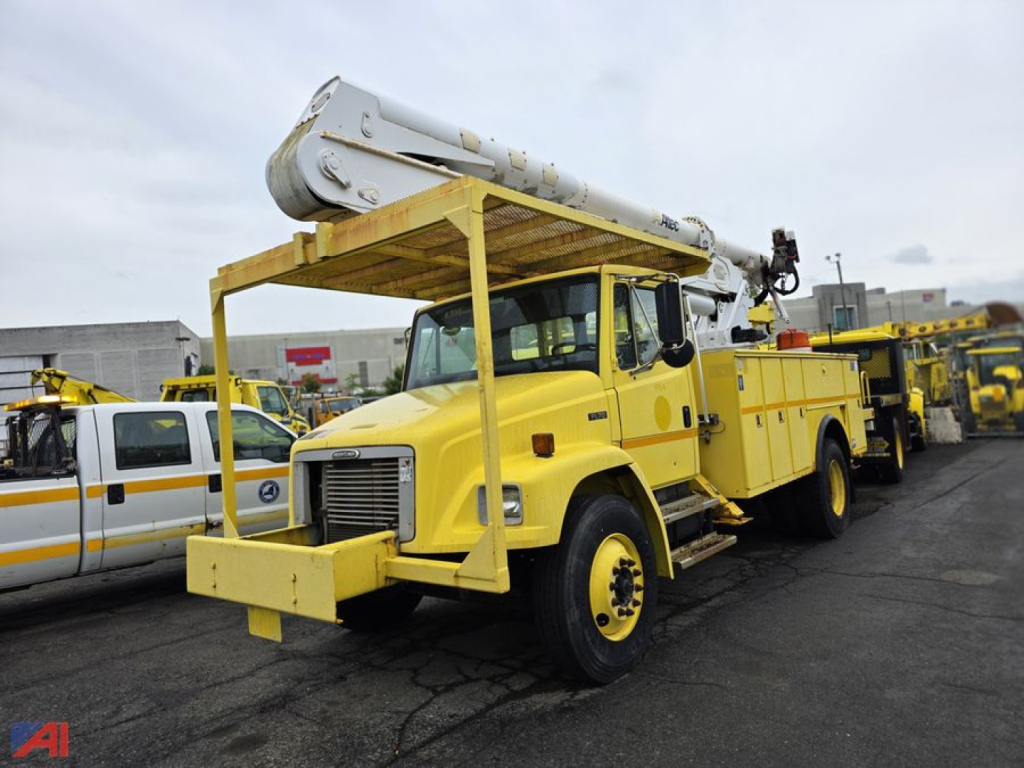 A yellow Freightliner FL70 bucket truck with Altec boom, utility body, and bucket platform showing front and side view.