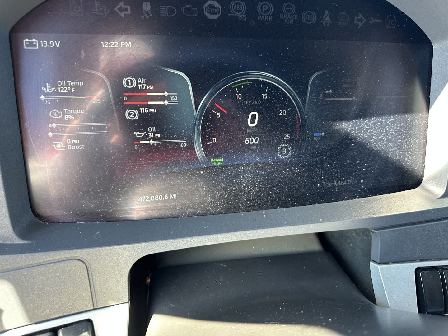 Kenworth T680 dash cluster showing digital gauges including speedometer and various status indicators.