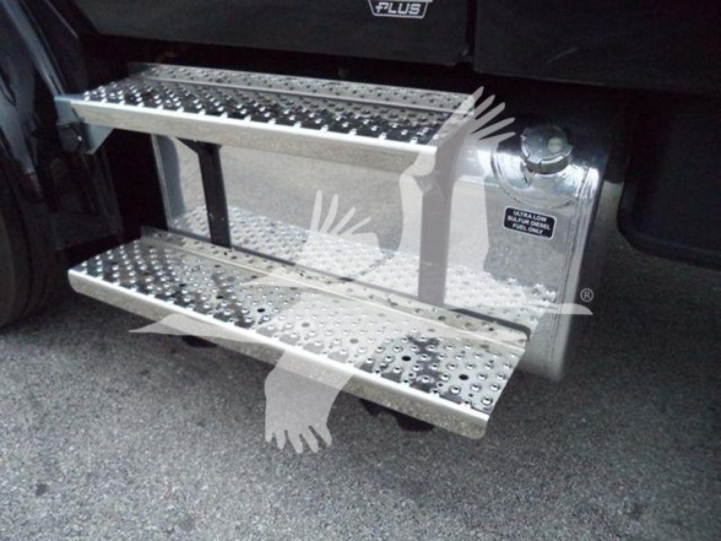 Freightliner M2 106 side steps (permanent) with metal tread and chrome finish, view of reach-styled running boards next to cab