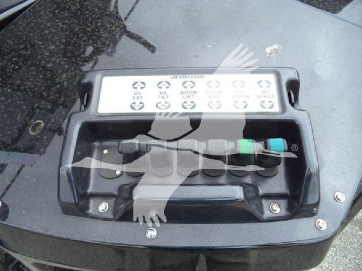 Winch control panel on Freightliner M2 106 with labeled levers and color-coded grips.
