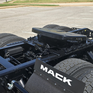Mack AN64T chassis with rear cab area and dual rear axles, Mack branding plate visible on the trailer chassis.