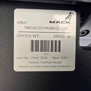 Mack plate and VIN sticker on truck showing VIN 1M1A23GY9VM102229, GROSS WT 16500 lb, Axle Wts Front 9720 Rear 6780, barcode, 'Factory Certified Weight', minimal fuel & before body builder modification